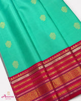 Turquoise Silk Saree with Pink Border