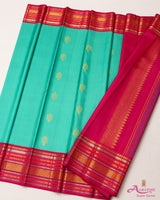Turquoise Silk Saree with Pink Border