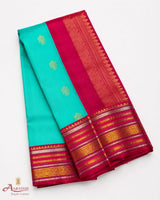 Turquoise Silk Saree with Pink Border